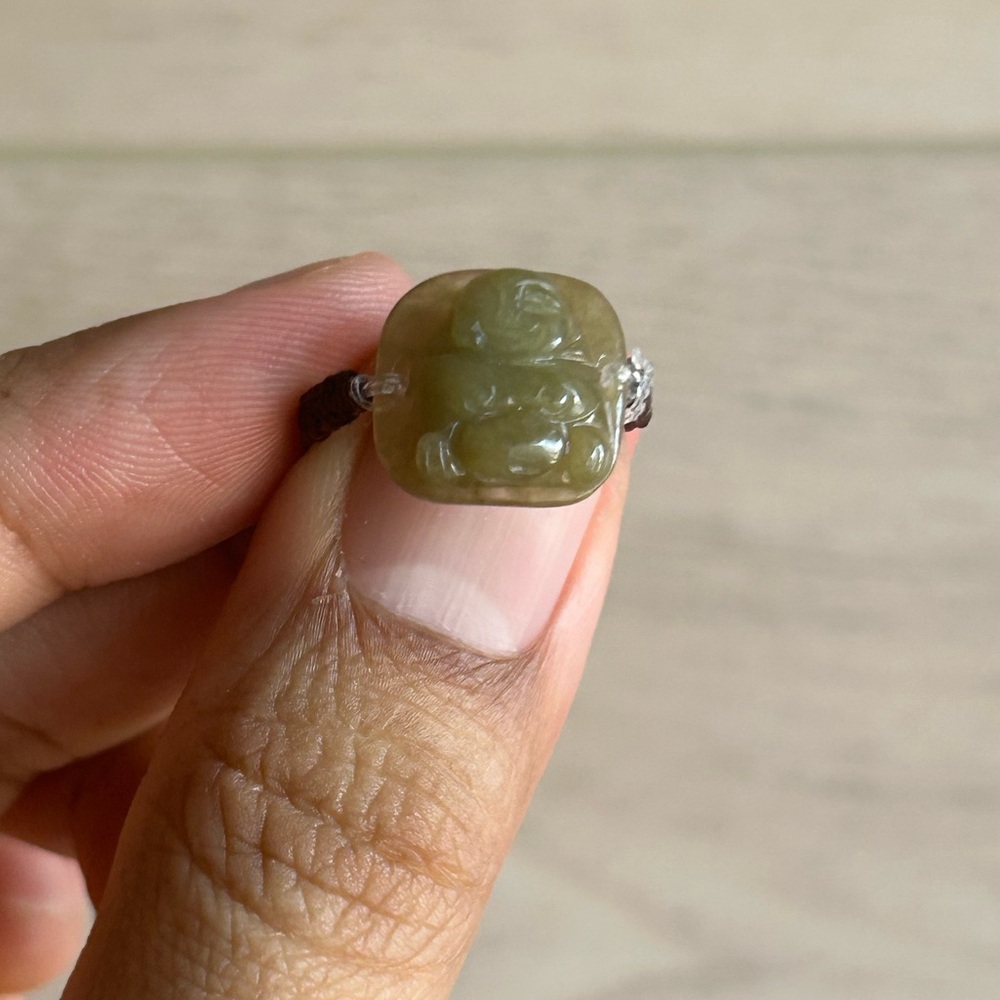 •Carved Jade Ring Laughing Buddha, Size 7”